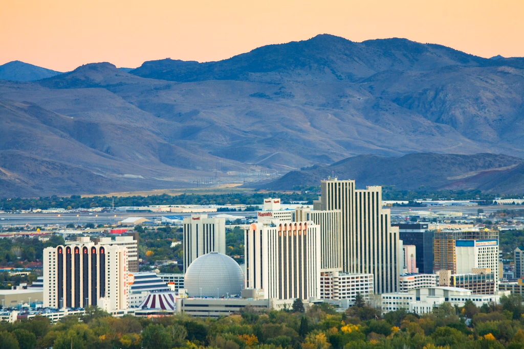 Downtown Reno casino towers below the Sierra Nevada foothills